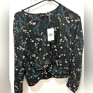 Work blouse. Black with floral print.